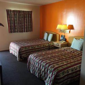 Postel nebo postele na pokoji v ubytování Avalon Motel