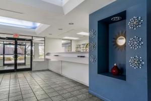 a kitchen with a blue wall with snowflakes on it at Rodeway Inn Wesley Chapel in Wesley Chapel
