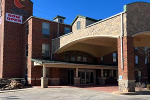 a large brick building with a now open sign on it at Comfort Inn & Suites in Lubbock