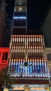 a building with lights on the front of it at Ruby Hotel in Ho Chi Minh City