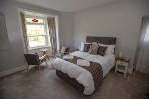 Un pat sau paturi într-o cameră la The Berwyn Arms