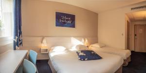 Postel nebo postele na pokoji v ubytování Ace Hotel Issoire