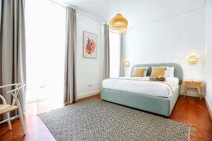 Postel nebo postele na pokoji v ubytování Endless Summer Apartment + 14 fotografií