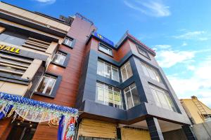 a building with christmas decorations in front of it at FabHotel Grand Arya in Patna