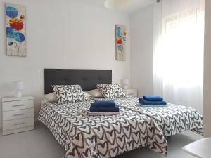 A bed or beds in a room at ElRincónDeSara Még 37 kép