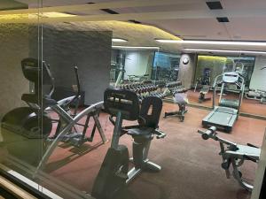 a gym with several treadmills and exercise bikes at Grand Makel Hotel Topkapi in Istanbul