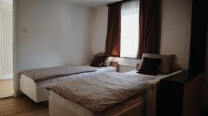 Postel nebo postele na pokoji v ubytování Gondola Apartment