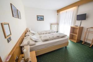 Postelja oz. postelje v sobi nastanitve Garnì BUCANEVE
