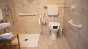 a bathroom with a toilet and a shower at Hotel La Smorfia in Castiglioncello