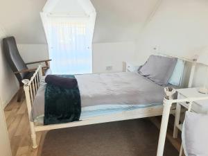 Voodi või voodid majutusasutuse Teach Eoin toas