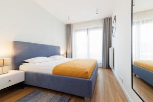 Postel nebo postele na pokoji v ubytování DreamHouse Apartamenty Darłówko Nautic Park + 25 fotografií