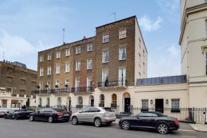 a group of cars parked in front of a building at The Belgravia Residences in London