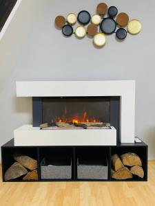 a fireplace in a living room with a fire place at Ferienwohnung Hotel Glockenhof in Eltville
