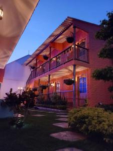 a building with a balcony on the side of it at FÁTIMA REAL in Ríohacha