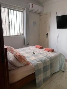 מיטה או מיטות בחדר ב-Apto na Avenida Marques de Herval