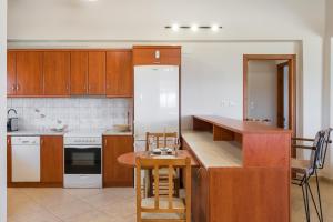 A kitchen or kitchenette at Villa Cleronomia, private pool, seaview,