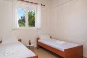 A bed or beds in a room at Villa Cleronomia, private pool, seaview,