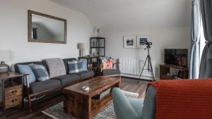 TV a/nebo společenská místnost v ubytování May Isle Apartment