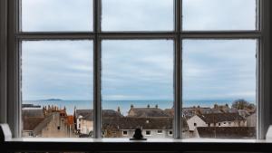 a view of a city from a window at May Isle Apartment in Anstruther