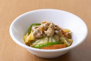 a white bowl of food with meat and vegetables at Hotel Wing International Premium Osaka-Shinsekai in Osaka