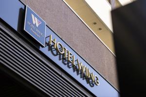 a sign for the hilton australia building at Hotel Wing International Premium Osaka-Shinsekai in Osaka