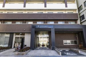 an entrance to a building with the doors open at Hotel Wing International Premium Osaka-Shinsekai in Osaka