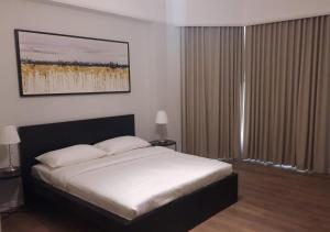 Posteľ alebo postele v izbe v ubytovaní Al Faris Suites 2