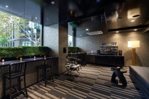a bar with a person sitting at a counter at 57Hotel in Sydney