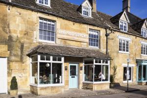 a building with a sign on the front of it at The Old Stocks Inn in Stow on the Wold