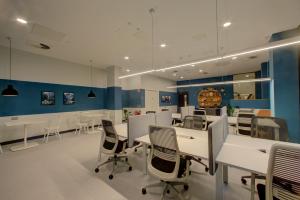a conference room with white tables and chairs at Destiny Student - Broga House Cork in Cork