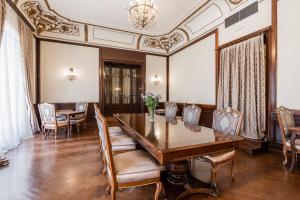 a dining room with a table and chairs at Hotel Bellevue - Liburnia in Opatija