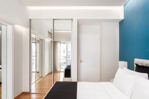 A bed or beds in a room at Acropolis Prestige Residence