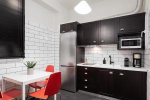 A kitchen or kitchenette at Acropolis Prestige Residence