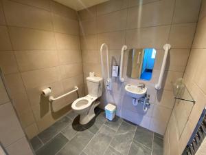 a bathroom with a toilet and a sink at Croyde Bay Hotel or Self Catering in Croyde