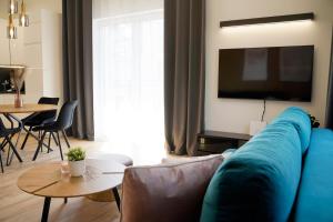 Televízia a/alebo spoločenská miestnosť v ubytovaní Apartament 15 Double Rest Jastrzębia Góra