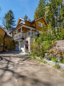 a large house with a driveway in front of it at Villa Lövkulla with Sauna in Löparö