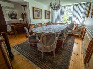 a dining room with a table and chairs at Villa Lövkulla with Sauna in Löparö