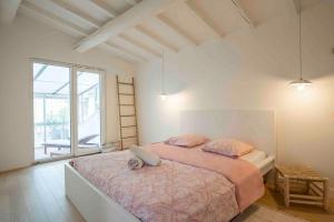 a bedroom with a large bed and a large window at Bel Appart avec CLIM en DUPLEX - TERRASSE - Wifi in Avignon