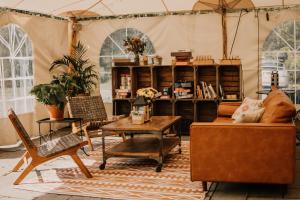 a living room with a couch and a table at Firelight Camps in Ithaca