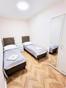 Postel nebo postele na pokoji v ubytování Orange Tree Hotel