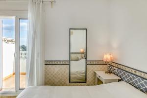 A bed or beds in a room at Casa con vistas al Mar Costa Bra