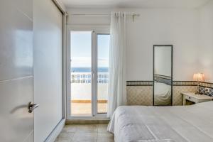A bed or beds in a room at Casa con vistas al Mar Costa Bra