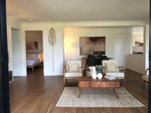 a living room with a couch and a coffee table at The COCO in The Entrance