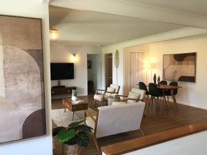 a living room with a couch and a table at The COCO in The Entrance