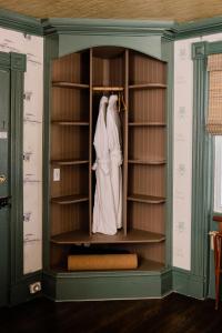 a closet in a room with a wedding dress in it at Fox & Bear Lodge in Glenwood