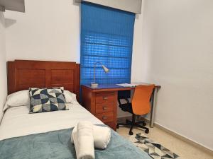 Postel nebo postele na pokoji v ubytování Céntrico Apartamento Jardines de Vallellano