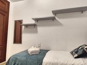 Postel nebo postele na pokoji v ubytování Céntrico Apartamento Jardines de Vallellano