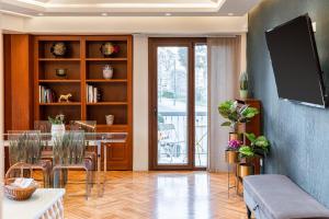 A television and/or entertainment centre at Acropolis Prestige Residence