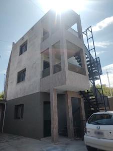 a building with a staircase on the side of it at Consorcio España 216 in San Juan