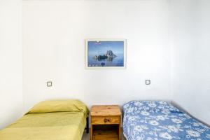 Posteľ alebo postele v izbe v ubytovaní Villa La Flor con piscina
